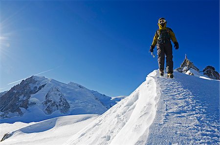 Europe, France, French Alps, Haute Savoie, Chamonix, Aiguille du Midi,  climber walking on the ridge MR Stock Photo - Rights-Managed, Code: 862-06541649