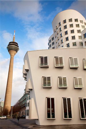 Dusseldorf, North Rhine Westphalia, Germany, Part of the Neuer Zollhof buildings and the Rheintuem tower in the background Stock Photo - Rights-Managed, Code: 862-06541767