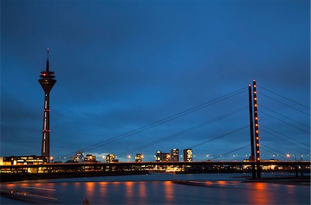 simsearch:841-07204692,k - Dusseldorf, North Rhine Westphalia, Germany, The Theodor Heus Bridge and the Rheinturm Tower prominent against a dramatic sunset Photographie de stock - Rights-Managed, Code: 862-06541775