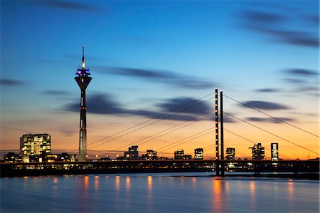 simsearch:841-07204692,k - Dusseldorf, North Rhine Westphalia, Germany, The Theodor Heus Bridge and the Rheinturm Tower prominent against a dramatic sunset Photographie de stock - Rights-Managed, Code: 862-06541777