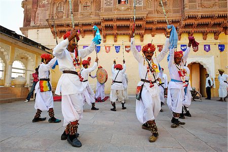 dancers of rajasthan - India, Rajasthan, Jodhpur. Within one of Mehrangarh Forts many courtyards, a troupe at the Rajasthan International Folk Festival, perform a traditional martial dance. Stock Photo - Rights-Managed, Code: 862-06541954