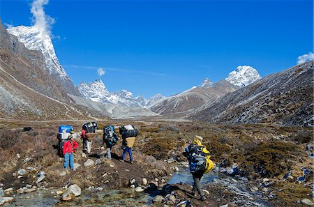 Asia, Nepal, Himalayas, Sagarmatha National Park, Solu Khumbu Everest Region, porters carrying loads Foto de stock - Con derechos protegidos, Código: 862-06542401
