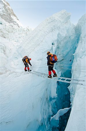 people not model release - Asia, Nepal, Himalayas, Sagarmatha National Park, Solu Khumbu Everest Region, the Khumbu icefall on Mt Everest, climbers crossing ladders over a crevasse Stock Photo - Rights-Managed, Code: 862-06542438