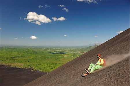 pente - Tourist Surfing down Volcan Cerro Negro, Leon, Nicaragua, Central America Photographie de stock - Rights-Managed, Code: 862-06542501