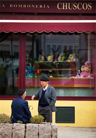 Spain, Galicia, Camino Frances, Two elderly Galician men talking in front of a shop Photographie de stock - Rights-Managed, Code: 862-06542832