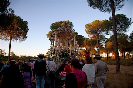 religious festival spain - Huelva, Southern Spain. Believers carrying a float with the Madonna, early morning a days distance on foot from the village of El Rocio where the feast takes place Stock Photo - Rights-Managed, Code: 862-06542964