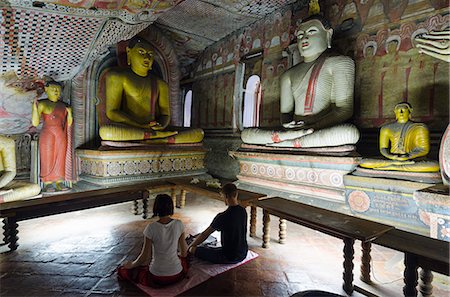 Sri Lanka, North Central Province, Dambulla, Golden Temple. , UNESCO World Heritage Site, Royal Rock Temple, Buddha statues in Cave 2, couple meditating Stock Photo - Rights-Managed, Code: 862-06543011