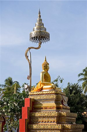 Thailand, Nakhon Phanom Province, a statue at Wat Phra That Phanom. One of the most important Theravada Buddhist structures in the region. Stock Photo - Rights-Managed, Code: 862-06543130