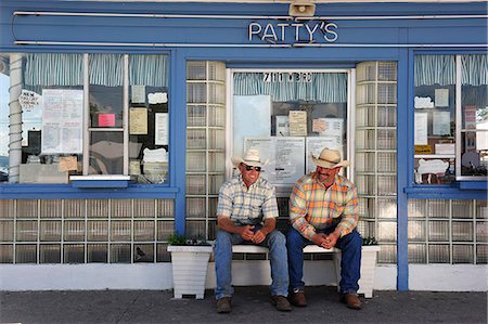 small town america - Two farm workers sat outside a ice cream parlour, Western Nebraska, USA Stock Photo - Rights-Managed, Code: 862-06543377