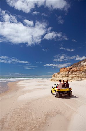 simsearch:862-06675755,k - South America, Brazil, Ceara, Morro Branco, tourists riding along a long sandy beach next to the sandstone cliffs near Morro Branco Foto de stock - Con derechos protegidos, Código: 862-06675758