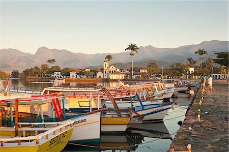 simsearch:862-06676807,k - Brazil, Parati, the Portuguese colonial town centre and the church of Saint Rita of Cascia seen from the water with fishing boats on the quay in the foreground Stock Photo - Rights-Managed, Code: 862-06675765