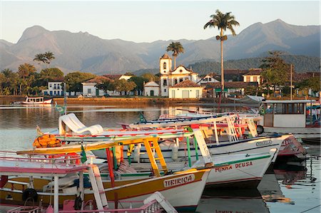 simsearch:862-06676807,k - Brazil, Parati, the Portuguese colonial town centre and the church of Saint Rita of Cascia seen from the water with fishing boats on the quay in the foreground Stock Photo - Rights-Managed, Code: 862-06675767