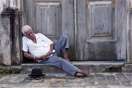 simsearch:862-06675787,k - South America, Brazil, Alagoas, Marechal Deodoro, an old man sleeping in the door of a baroque church in the old state capital Stock Photo - Rights-Managed, Code: 862-06675790