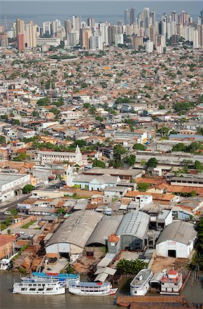 South America, Brazil, Para, Amazon, an aerial shot of the city of Belem in the southern mouth of the Amazon confluence, showing skyscraper apartment blocks river boats docked on the waterfront, and Guajara Bay Foto de stock - Con derechos protegidos, Código: 862-06675928