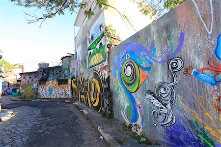 street walls - South America, Brazil, Sao Paulo, Vila Madalena, the Beco do Batman   an alley covered in Brazilian graffiti under the yellow neon glow of the Sao Paulo sky Stock Photo - Rights-Managed, Code: 862-06676084