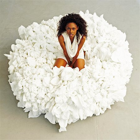 South America, Brazil, Sao Paulo, a model sits on a pouffe made from recycled material by the artist and designer Nido Campolongo Stock Photo - Rights-Managed, Code: 862-06676122