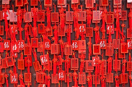 China, Yunnan, Jianshui. Lucky prayer tokens at the Confucian Temple at Jianshui. Photographie de stock - Rights-Managed, Code: 862-06676260