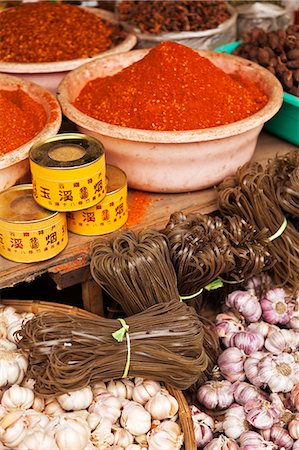 China, Yunnan, Jinghong. Spices and noodles for sale at Jinghong market. Stock Photo - Rights-Managed, Code: 862-06676335