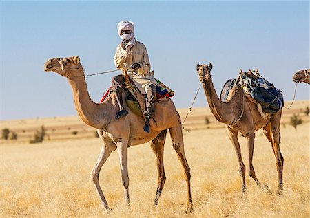 simsearch:862-06676382,k - Chad, Batha, Wadi Achim, Sahel. An Arab Ouled Sliman man rides his camel to collect water at Wadi Achim s deep well. Stock Photo - Rights-Managed, Code: 862-06676388