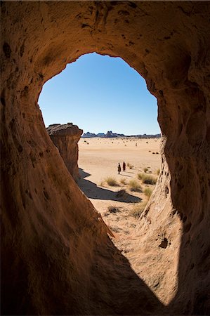 simsearch:862-06676456,k - Chad, Gaora Hallagana, Ennedi, Sahara. A natural window in a weathered sandstone rock feature. Stock Photo - Rights-Managed, Code: 862-06676404