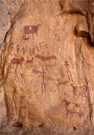 simsearch:862-06676393,k - Chad, Elikeo, Ennedi, Sahara. A rock art panel depicting humans and decorated cattle. Foto de stock - Con derechos protegidos, Código: 862-06676421