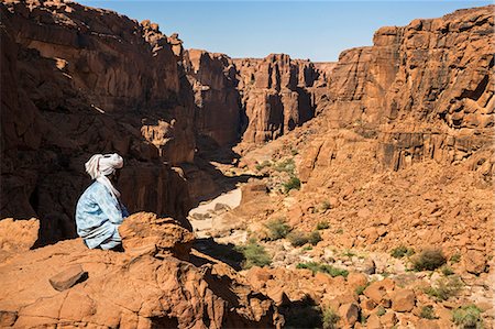 simsearch:862-06676456,k - Chad, Wadi Archei, Ennedi, Sahara. A young Toubou boy looks out over Wadi Archei. Stock Photo - Rights-Managed, Code: 862-06676506