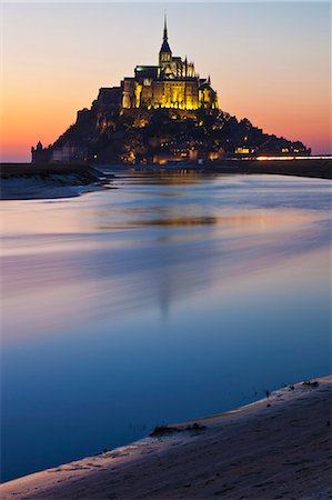 education religion - Mont Saint Michel and its connection to the mainland via a tidal causeway with the River Couesnon on the left at low tide at sunset, Le Mont Saint Michel, Basse Normandie, France. Stock Photo - Rights-Managed, Code: 862-06676766