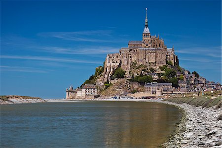 education religion - Mont Saint Michel and its connection to the mainland via a tidal causeway with the River Couesnon on the left at high tide, Le Mont Saint Michel, Basse Normandie, France. Stock Photo - Rights-Managed, Code: 862-06676777