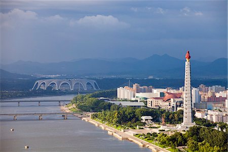 simsearch:862-06677209,k - Democratic Peoples Republic of Korea, North Korea, Pyongyang. View of the Juche Tower and Taedong River from the Yanggakdo Hotel. Stock Photo - Rights-Managed, Code: 862-06677201