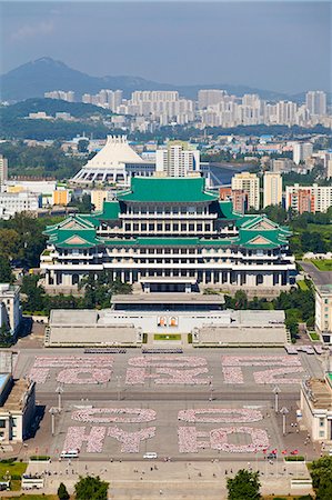 simsearch:862-06677209,k - Democratic Peoples Republic of Korea. North Korea, Pyongyang. Elevated view of Kim Il Sung Square and the Grand Peoples Study House showing rehearsals for the Youth Day Parade. Stock Photo - Rights-Managed, Code: 862-06677236