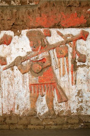 South America, Peru, La Libertad, Trujillo, detail of a mural on the Moche Temple of the Moon showing a moche priest or warrior with a mace or spear Fotografie stock - Rights-Managed, Codice: 862-06677316