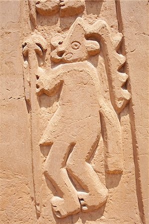 South America, Peru, La Libertad, Trujillo, an adobe bas relief from a mural on the Chimu House of the Dragon showing a figure in a headdress, part of the UNESCO World Heritage Listed Chan Chan archeological complex Photographie de stock - Rights-Managed, Code: 862-06677311