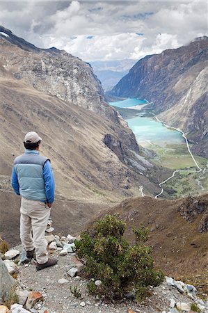 South America, Peru, Ancash, Cordillera Blanca. A hiker looking out over the Llanganuco lakes on the Santa Cruz trek in Huascaran National Park Photographie de stock - Rights-Managed, Code: 862-06677426