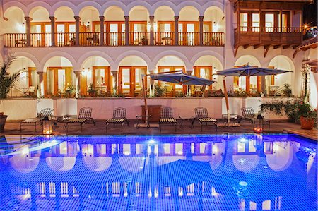 South America, Peru, Cusco, the swimming pool at the in the Orient Express Palacio Nazarenas hotel, housed in a former Spanish convent, PR, Photographie de stock - Rights-Managed, Code: 862-06677440