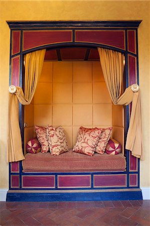 South America, Peru, Cusco, silk cushions in an alcove seat in the presidential suite at the Orient Express Monasterio hotel, housed in a former Spanish convent, PR, Photographie de stock - Rights-Managed, Code: 862-06677442