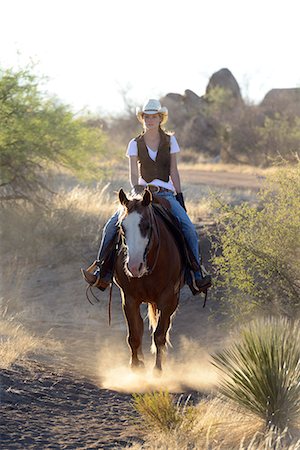 Cowgirl riding, Apache Spirit Ranch, Tombstone, Arizona, USA Photographie de stock - Rights-Managed, Code: 862-06677537