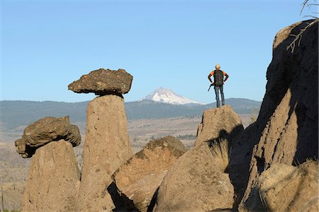 person climbing a volcano - Man climbing up on Hoodoo, Balanced Rocks, Jefferson County, near Lake Billy Chinook, Culver, Central Oregon, USA Stock Photo - Rights-Managed, Code: 862-06677582