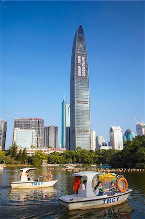 Pedaloes in Lizhi Park in front of Kingkey 100 Finance Building, Shenzhen, Guangdong, China Stock Photo - Rights-Managed, Code: 862-06825185