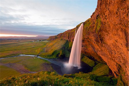 Iceland, southern region, Seljalandsfoss waterfall, sunset Photographie de stock - Rights-Managed, Code: 862-06825669