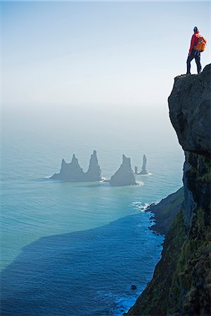 standing alone cliff - Iceland, southern region, Vik, rock stacks off the coast at Reynisdrangar (MR) Stock Photo - Rights-Managed, Code: 862-06825683