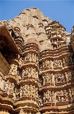 simsearch:862-06825843,k - Asia, India, Madhya Pradesh, Khajuraho. Kandariya Mahadev temple, detail of erotic sculptures adorning the exterior. Stock Photo - Rights-Managed, Code: 862-06825841