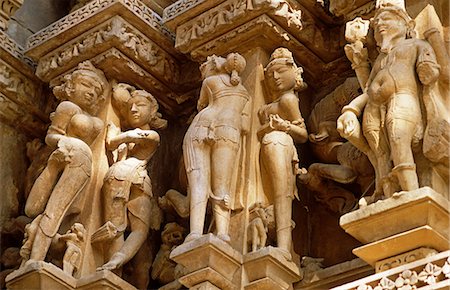 simsearch:862-06825847,k - Asia, India, Madhya Pradesh, Khajuraho.  Adinath temple.  Detail of the celestrial maidens carved in stone on the exterior. Stockbilder - Lizenzpflichtiges, Bildnummer: 862-06825842