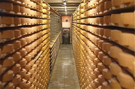 factory cheese - Gruyere cheese in cellar at La Maison du Gruyere, Gruyeres, Fribourg, Switzerland Stock Photo - Rights-Managed, Code: 862-06826238