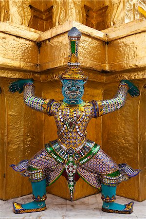 simsearch:851-02963398,k - Thailand, Bangkok.  Statue at Wat Phra Kaeo, Temple of the Emerald Buddha, within the grounds of the Royal Grand Palace. Stock Photo - Rights-Managed, Code: 862-06826286