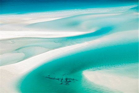 Australia, Queensland, Whitsundays, Whitsunday Island.  Aerial view of shifting sand banks and turquoise waters of Hill Inlet in Whitsunday Islands National Park. Photographie de stock - Rights-Managed, Code: 862-07495765