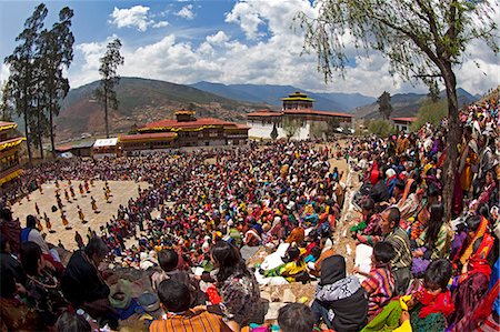 Asia, Paro Dzong, Paro, Bhutan. Bhutanese watching the dancing and celebrations at the Paro Festival. Stock Photo - Rights-Managed, Code: 862-07495778