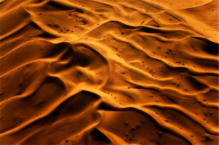 simsearch:862-06677186,k - Africa, Sossusvlei, Namib Desert, Namibia. Ripples on Sand dunes at Sossusvlei caused by the wind. Stock Photo - Rights-Managed, Code: 862-07496232