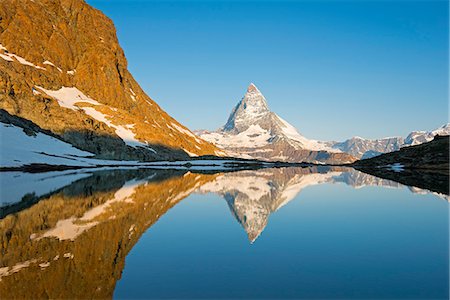 snow covered mountains - Europe, Valais, Swiss Alps, Switzerland, Zermatt, The Matterhorn (4478m), Rifelsee lake Stock Photo - Rights-Managed, Code: 862-07496302