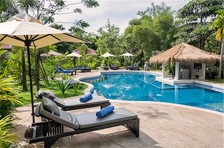 Cambodia, Siem Reap, Siem Reap Province. The swimming pool at Sojourn Villa, a small boutique hotel on the outskirts of Siem Reap. Stock Photo - Rights-Managed, Code: 862-07689865