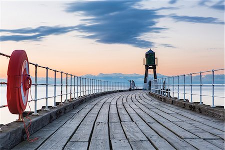 sunset pier - United Kingdom, England, North Yorkshire, Whitby. The West Pier at dusk. Stock Photo - Rights-Managed, Code: 862-07689973